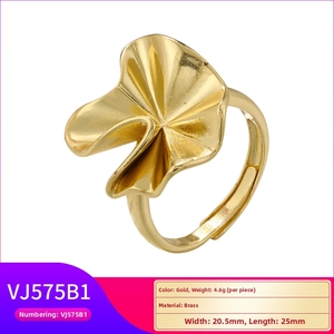 Detail view of adjustable gold brass ring with abstract petal design and 4.6g weight