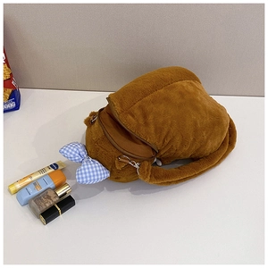 Brown capybara plush crossbody bag with blue checkered bow and various beauty accessories