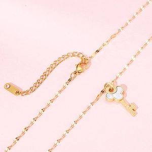 Golden key pendant necklace with mother of pearl shell inlay and dainty cable chain link