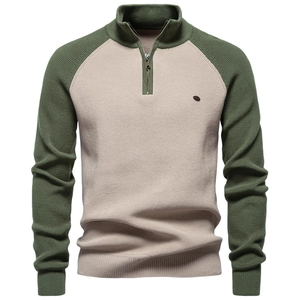 Detail of men's quarter-zip knit sweater in army green and beige color-block design