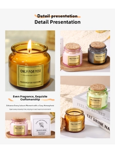 Close-up of glass scented candle jars with cork lids and gold foil labels on white box