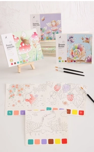 Close-up of portable watercolor book with built-in paint palette and brush for kids