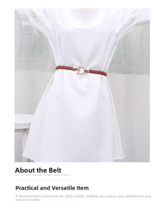 Detail of slim brown leather belt with gold buckle on white dress for women