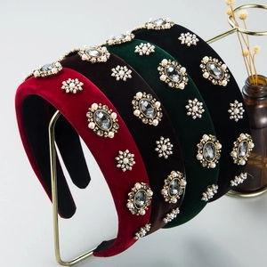 Baroque velvet headbands with pearls and rhinestones in four vintage colors on gold rack