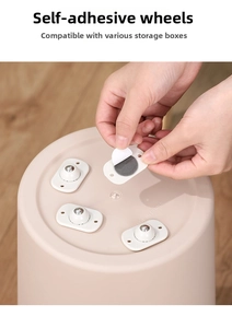 Applying self-adhesive universal swivel wheels to the bottom of a storage bin