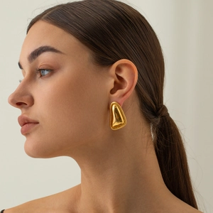 Detail of 18k gold plated stainless steel triangle earring with textured spiral edges