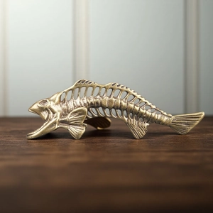 Vintage brass fish bone keychain pendant with antique finish and hollow carved design