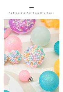 Macro shot of macaron-colored Christmas ornaments in sequin, foam and donut styles