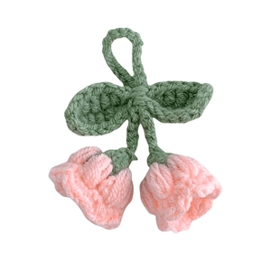 Handmade crochet lily of the valley keychain with pink flowers and green leaves