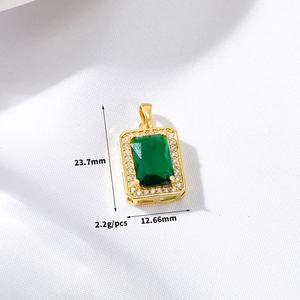 Macro shot of emerald-style pendant with dimensions 23.7mm by 12.66mm and 2.2g weight