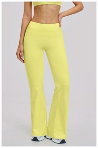 Detail view of high waist flared yoga pants in neon yellow with wide tummy control band