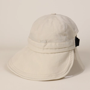 Detailed view of beige nylon sun hat showing wide brim and adjustable back buckle strap