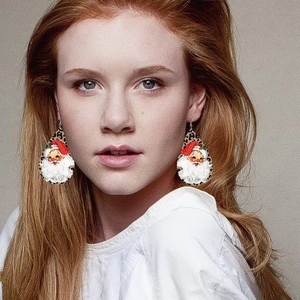 Christmas teardrop earrings with leopard print and Santa Claus on a female model