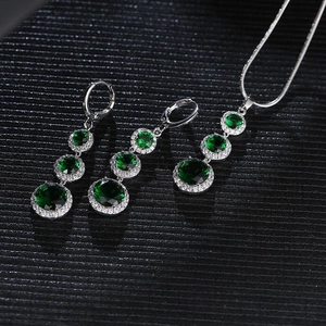 Elegant emerald and cubic zirconia jewelry set including teardrop necklace and earrings