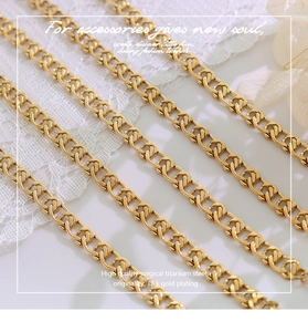 Macro detail of interlocking 18k gold plated surgical titanium steel necklace chains
