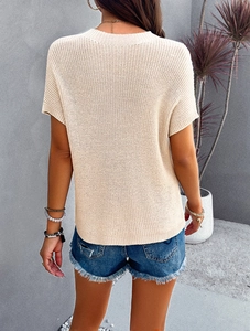 Detailed back view of a beige short-sleeve knit top with elegant high-neck texture