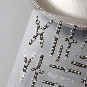 Macro view showing 5D embossed punk style nail art stickers with metallic rivets