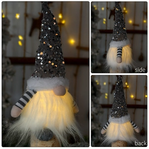 Detailed side and back views of a glowing grey sequined Christmas gnome with warm LED light