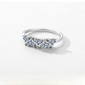 Detail of S925 sterling silver ring featuring five heart-shaped cubic zirconia stones