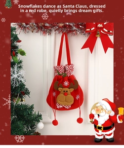 Detail of red flannel Christmas gift bag featuring a 3D reindeer face and soft pompom strings