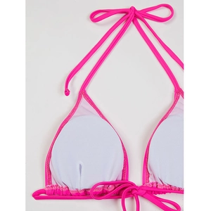 Detailed close-up of hot pink bikini top showing internal breathable lining and pad slots