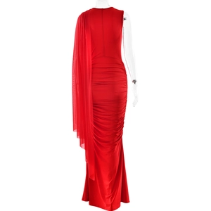 Detail of red sleeveless gown featuring elegant mesh drape and ruched bodycon design