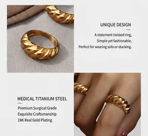 Macro detail of twisted croissant ring in 18K gold plated surgical titanium steel