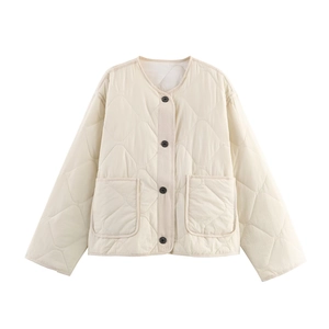 Detail of off-white quilted jacket featuring black buttons and symmetrical patch pockets