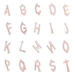 Rose gold stainless steel A-Z initial connectors with double holes on white background