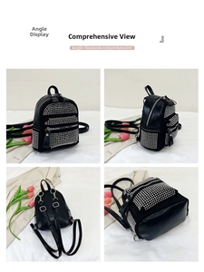 Vista detallada de mochila negra con strass, múltiples bolsillos de cremallera y correas