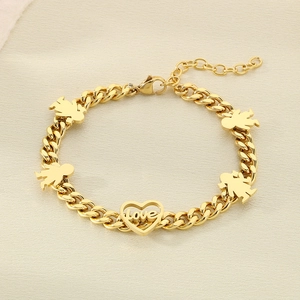 Detail of gold curb chain bracelet featuring love heart and children shaped pendants