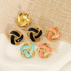 Golden knot earrings with colorful enamel dripping in black pink and mint green