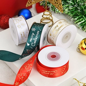 Detailed view of four festive Christmas ribbons in green, red, cream, and white colors