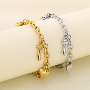 Fashionable stainless steel bracelets featuring heart and key charms in gold and silver
