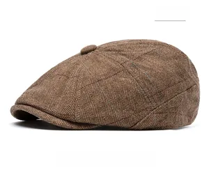 Detailed side view of khaki herringbone flat cap with red and blue checkered pattern
