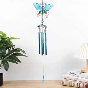 Detail of blue metal butterfly wind chime with hollow wings and four aluminum sound tubes