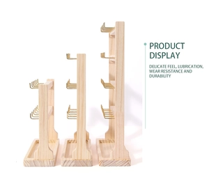 Three-tier wooden jewelry display stands with metal hooks for necklaces and rings