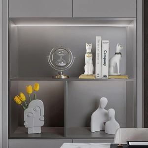 Artistic Bastet cat bookends and modern home decor set in minimalist cabinet display