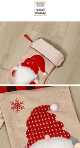 Detail of Christmas gnome stocking with white beard embroidery and hanging loop