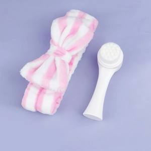 Pink striped bow headband and ergonomic white soft bristle facial cleansing brush set
