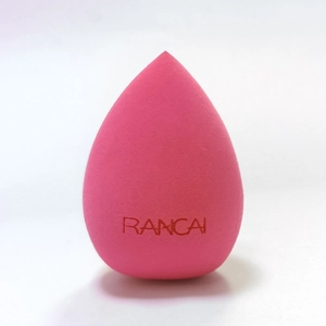Macro detail of a soft pink teardrop beauty sponge with fine non-latex texture