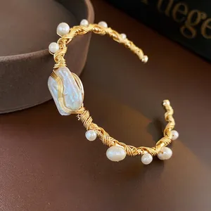 Elegant Baroque pearl wrap bangle in gold wire finish featuring a luxury open design