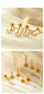 Detailed view of gold plated surgical steel labret studs with various zircon shapes