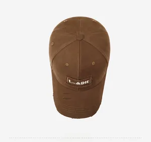 Top view of brown distressed baseball cap with LA & DH embroidery and frayed brim details