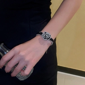 Elegant French style camellia crystal bracelet with black finish and sparkling rhinestones