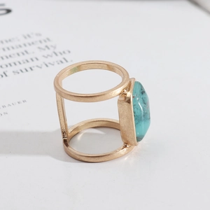 Retro gold ring featuring a turquoise oval stone on a unique double parallel band