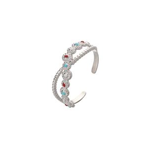 Detail showing bohemian hollow ring with red, blue, and white beads in stainless steel