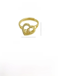 Macro shot of gold-plated brass heart ring with letter A and micro-set cubic zirconia
