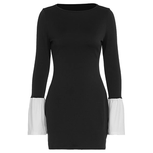 Detail of white flared pleated cuffs on the black long sleeve slim fit dress