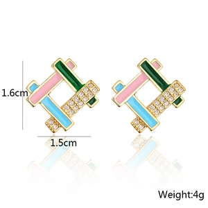 Detail view of 18K gold plated geometric earrings with colorful enamel and cubic zirconia